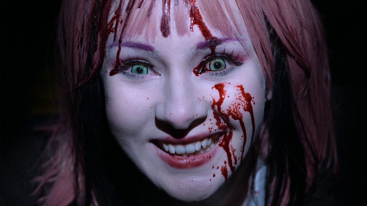 Miss Mutter smiles with blood on her face in Spoiling You
